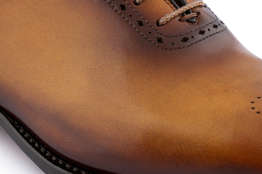 Stringata in pelle dipinta a mano